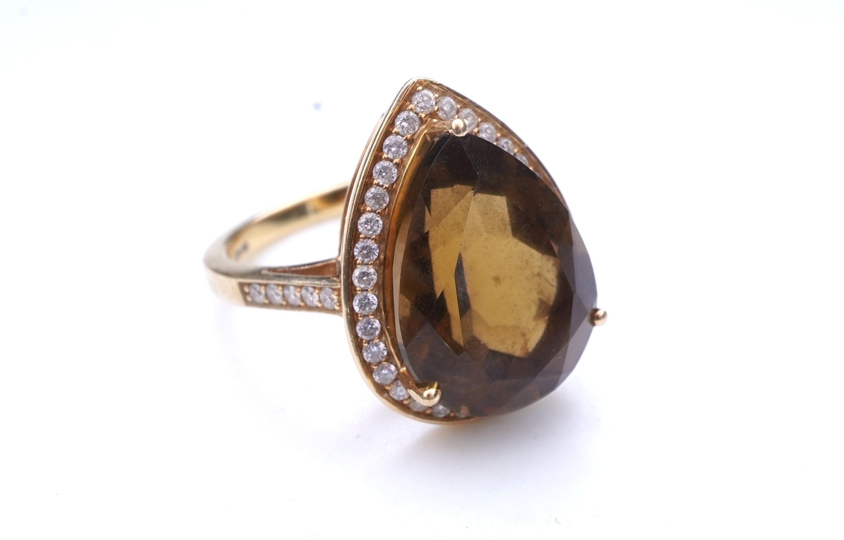 A smoky quartz and diamond ring